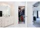 En-suite bathroom featuring vanity, walk-in closet, and easy access to the main bedroom at 4955 Day Lily Nw Way, Acworth, GA 30102