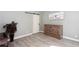 Neutral bedroom with gray walls, wood-look flooring, and sliding barn door at 4955 Day Lily Nw Way, Acworth, GA 30102