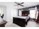 Well-lit bedroom with a striking accent wall and comfortable furnishings at 4955 Day Lily Nw Way, Acworth, GA 30102