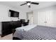 Comfortable bedroom with a ceiling fan, dresser, and double door closet at 4955 Day Lily Nw Way, Acworth, GA 30102