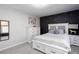 Bedroom with dark accent wall, white furniture and natural light from windows at 4955 Day Lily Nw Way, Acworth, GA 30102
