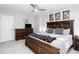 Bedroom with a wooden bed frame, a dresser, and carpeted floors, providing a comfortable living space at 4955 Day Lily Nw Way, Acworth, GA 30102