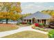 Attractive brick clubhouse entrance with an arched portico and vibrant floral landscaping near a community pool at 4955 Day Lily Nw Way, Acworth, GA 30102