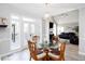 Dining area with outdoor access and open to the living room with vaulted ceilings at 4955 Day Lily Nw Way, Acworth, GA 30102