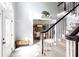 Welcoming foyer featuring a staircase, front door, and view into the dining room, complete with light gray walls at 4955 Day Lily Nw Way, Acworth, GA 30102
