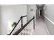 Hallway with staircase and neutral walls, a clean and bright design at 4955 Day Lily Nw Way, Acworth, GA 30102