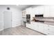 Kitchen with desk area, gas cooktop, built-in oven and microwave, and modern finishes at 4955 Day Lily Nw Way, Acworth, GA 30102