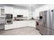 Bright kitchen with stainless steel appliances, white cabinetry, and modern finishes at 4955 Day Lily Nw Way, Acworth, GA 30102