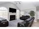 Spacious living room featuring a fireplace, vaulted ceilings, and large windows offering natural light at 4955 Day Lily Nw Way, Acworth, GA 30102