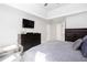Spacious main bedroom featuring neutral decor, tray ceiling, and ample closet space for organized storage at 4955 Day Lily Nw Way, Acworth, GA 30102