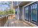 Wooden back deck features a wooden railing and dark doors leading to the house at 971 Lake Watch Ct, Stone Mountain, GA 30088