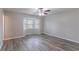 An empty bedroom with gray walls, modern floors and a cozy bay window is bright and spacious at 971 Lake Watch Ct, Stone Mountain, GA 30088