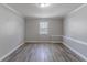 Bright, minimalist bedroom with large window at 971 Lake Watch Ct, Stone Mountain, GA 30088