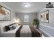 Relaxing bedroom with a cozy bed and decorative pillows and art at 971 Lake Watch Ct, Stone Mountain, GA 30088