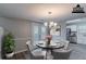 Charming dining area with stylish lighting and a walk-out to a deck at 971 Lake Watch Ct, Stone Mountain, GA 30088