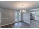 Bright dining space offers a walk-out to the deck and kitchen access at 971 Lake Watch Ct, Stone Mountain, GA 30088