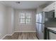 Modern kitchen featuring stainless steel appliances and a window at 971 Lake Watch Ct, Stone Mountain, GA 30088