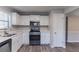 Modern kitchen featuring stainless steel appliances and white cabinets at 971 Lake Watch Ct, Stone Mountain, GA 30088