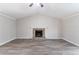 Spacious living room with vaulted ceiling and stone fireplace focal point at 971 Lake Watch Ct, Stone Mountain, GA 30088