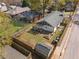 Aerial view of a fenced backyard with a patio, pergola, and lush greenery showing the outdoor living space at 1479 Hartford Sw Ave, Atlanta, GA 30310
