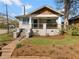 Charming bungalow with a brick facade, inviting porch, and well-manicured lawn at 1479 Hartford Sw Ave, Atlanta, GA 30310