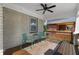 Cozy front porch with seating, ceiling fan, painted brick, and wooden accents at 1479 Hartford Sw Ave, Atlanta, GA 30310