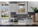 Bright kitchen features granite countertops, stainless steel sink, and a view of the backyard at 1479 Hartford Sw Ave, Atlanta, GA 30310