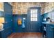 Mud room with blue wainscoting, storage bench, and coat hooks at 1479 Hartford Sw Ave, Atlanta, GA 30310
