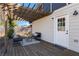 Inviting outdoor patio with pergola, stylish seating, and well-maintained wood flooring at 1479 Hartford Sw Ave, Atlanta, GA 30310