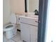 Bathroom featuring a toilet, tub, vanity, mirror, and a neutral color palette at 2425 River Place Xing, Douglasville, GA 30135