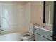 Bathroom featuring a toilet, tub, vanity, mirror, and a neutral color palette at 2425 River Place Xing, Douglasville, GA 30135