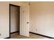 Bedroom featuring an open closet and neutral walls with contrasting trim at 2425 River Place Xing, Douglasville, GA 30135