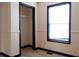 Bedroom featuring a window and closet with neutral walls and contrasting trim at 2425 River Place Xing, Douglasville, GA 30135