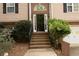 A brick stairway leading to the front door with manicured landscaping at 2425 River Place Xing, Douglasville, GA 30135
