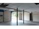 Spacious garage with overhead lighting, support beams and open door at 2425 River Place Xing, Douglasville, GA 30135