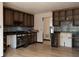 Kitchen view shows open cabinets and tile backsplash at 2425 River Place Xing, Douglasville, GA 30135