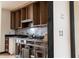 Kitchen view shows open cabinets and tile backsplash at 2425 River Place Xing, Douglasville, GA 30135