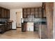Kitchen view shows open cabinets and tile backsplash at 2425 River Place Xing, Douglasville, GA 30135