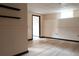 Living room featuring neutral paint, wood floors and black trim at 2425 River Place Xing, Douglasville, GA 30135