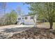 Exterior of a two-story home featuring a two car garage and a basketball hoop at 114 Connie Dr, Dallas, GA 30157