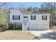 Attractive home with a two-car garage, symmetrical windows, and a well-maintained lawn at 114 Connie Dr, Dallas, GA 30157