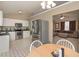 Kitchen with adjacent living room showcasing stainless steel appliances and a cozy eat-in space at 114 Connie Dr, Dallas, GA 30157