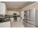 Functional kitchen featuring white cabinetry and stainless steel appliances and eat in area at 114 Connie Dr, Dallas, GA 30157