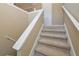 A carpeted staircase with neutral walls leads to the next level at 114 Connie Dr, Dallas, GA 30157