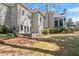 Expansive backyard with well-maintained lawn, stone patio, mature trees, and lush landscaping at 303 Rolling Rock Se Rd, Marietta, GA 30067