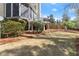 A spacious backyard with a screened porch and well-maintained lawn area, perfect for outdoor activities at 303 Rolling Rock Se Rd, Marietta, GA 30067