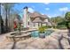 Backyard with a beautiful pool and jacuzzi, offering a serene outdoor retreat at 303 Rolling Rock Se Rd, Marietta, GA 30067