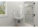 Modern bathroom featuring a vessel sink, large mirror and a glass enclosed walk-in shower at 303 Rolling Rock Se Rd, Marietta, GA 30067