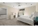 This bedroom has a vanity area, window views, and a ceiling fan, creating a relaxed and functional space at 303 Rolling Rock Se Rd, Marietta, GA 30067