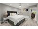 Bedroom with hardwood flooring and bench seating by a window, and view to the hallway at 303 Rolling Rock Se Rd, Marietta, GA 30067